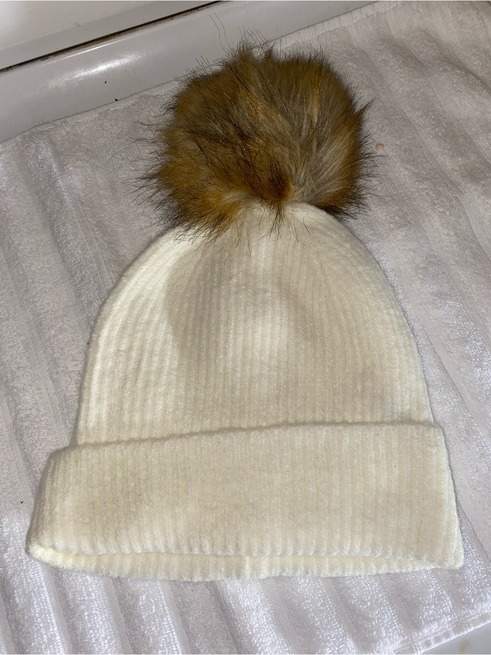 BCBGeneration Cream Ribbed Beanie with Tan Faux Fur Pom